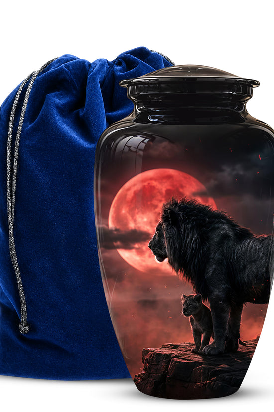 Cremation urn with lion design and blue drawstring bag on white background